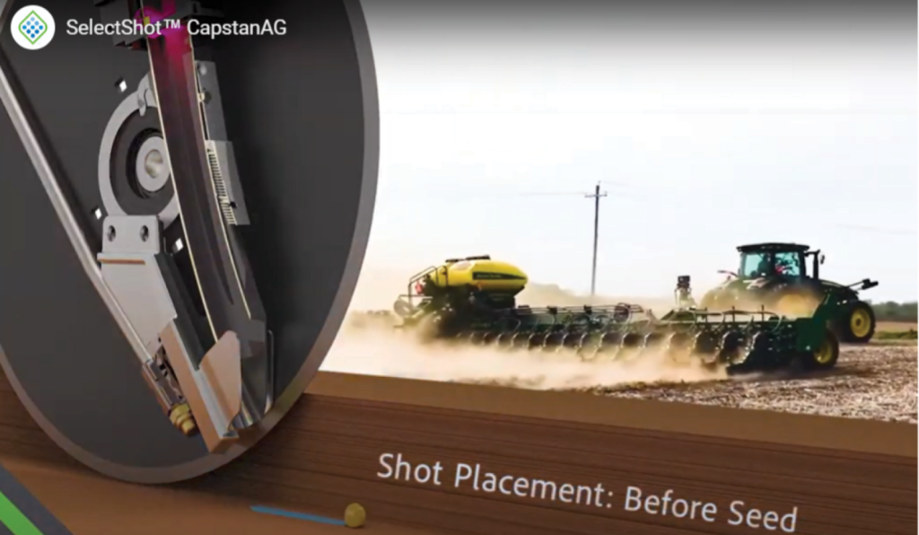 a commercial harvester in the background and a seed shot.